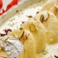 Rasmalai (4 Pieces) · A sweet cottage cheese ball soaked in a thickened, sweetened and flavored milk.
