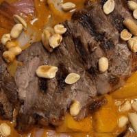 Steak Curry* · Grilled‎ Slices of Marinated New York Steak Topped with Brown Curry, Potatoes, Pineapples, R...