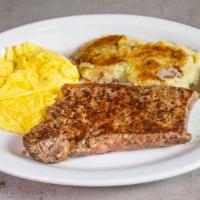 Steak And Eggs · Hand-cut 10 oz new york strip cooked to order with two eggs any style, potato cakes and your...