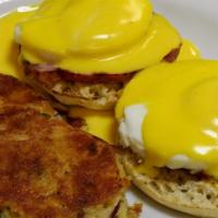 Rupert’S Classic Benedict · English muffins topped with Canadian bacon, poached eggs, and hollandaise sauce. Served with...