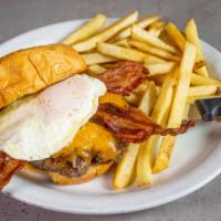 Hangover Burger · Our handmade Angus burger on a brioche bun with Cheddar cheese, bacon, and an egg. With Fries.