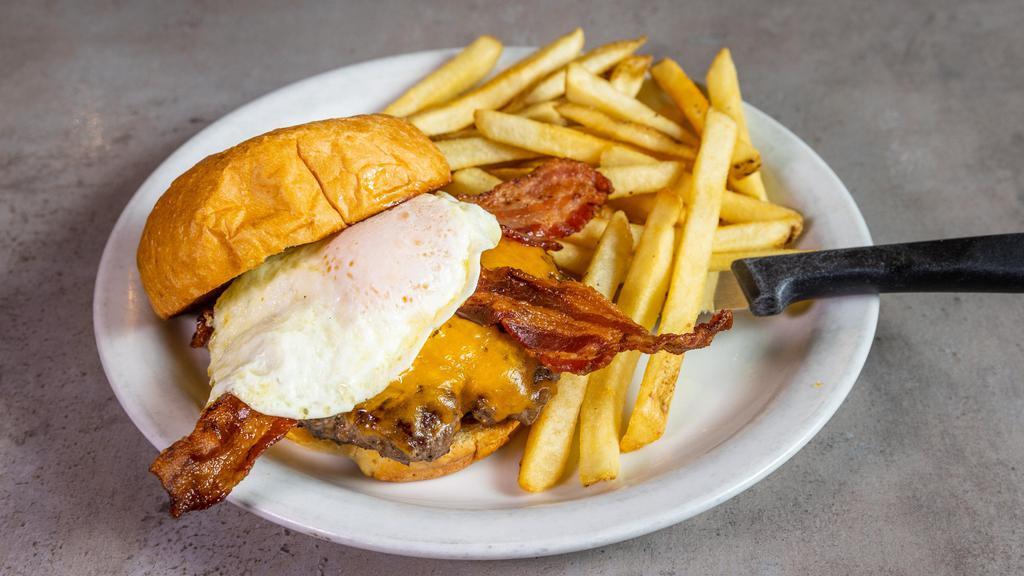 Hangover Burger · Our handmade Angus burger on a brioche bun with Cheddar cheese, bacon, and an egg. With Fries.