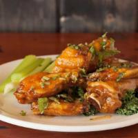 Buffalo Wings · Our famous jumbo wings…baked, deep fried and tossed in sauce of your choice.  Served with ce...