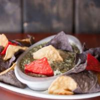 Spinach & Artichoke Dip · Now with double the artichoke! Served with tricolored tortilla chips.