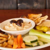 Hummus Plate · Freshly made hummus served with toasted naan, roasted garlic, feta cheese, kalamata olives, ...