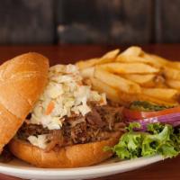 Slow-Roasted Pork Sando · Slow cooked and tangy, our own BBQ pork and housemade cole slaw are piled high atop a toaste...