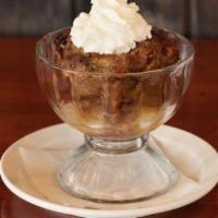 Bourbon Bread Pudding · Fresh crusty sourdough baked with sweet coconut custard and pecans then topped with bourbon ...