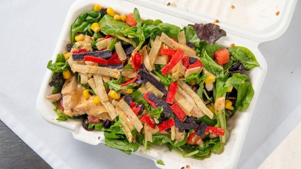 Sw Chipotle Chicken · Fresh seasonal mixed greens, grilled chicken, roasted corn, black beans, Roma tomatoes, black olives, tortilla strips, and dressing.