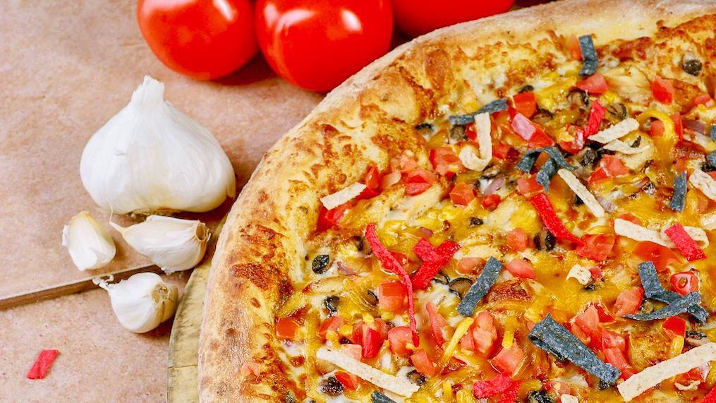 Southwestern Chicken (Extra Large) · This slightly spicy pizza may soon become your new favorite! Grilled chicken, black beans, roasted corn, tomatoes, red onions, and Cheddar cheese all on zesty chipotle pesto sauce! Buttermilk hand thrown crust.