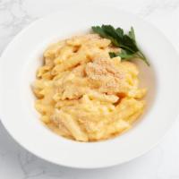 Macaroni & Cheese · A Side of Macaroni and Cheese made with penne pasta and creamy cheddar cheese sauce.