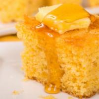 Cornbread · Muffins brushed with honey butter.