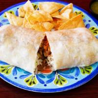 Vegan Steak Supreme Burrito · Burrito Served with Pinto Beans, Spanish Rice, Lettuce, Vegan Cheese and Sour Cream, and Veg...