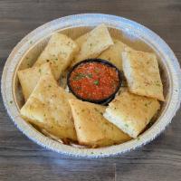 Brovie'S O.G. Bread · Our Original Garlic Bread, fresh-baked and served with a side. of Marinara