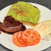 Avocado Toast · Sliced avocado half spread on toasted sourdough drizzled with olive salt and pepper. Served ...