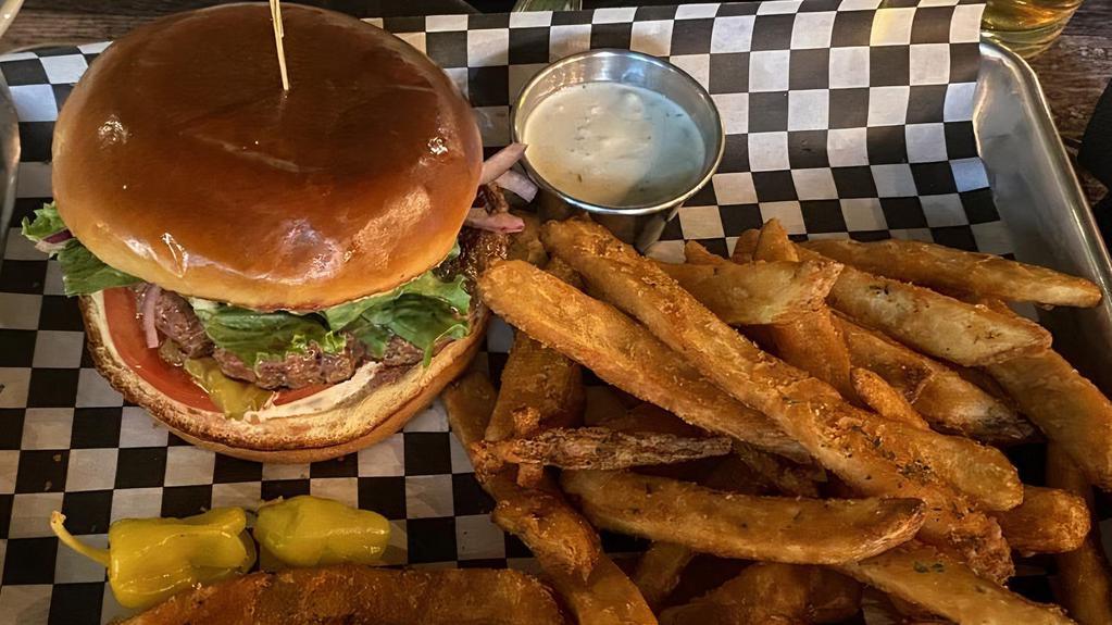 Classic Burger · ½ lb. beef patty topped with onions, pickles, aioli, ketchup, lettuce and tomato, on a brioche bun served with hand-cut fries
