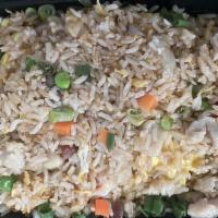 House Fried Rice · Wok-fried rice with BBQ pork, chicken, beef, shrimp egg peas, carrots and scallions.