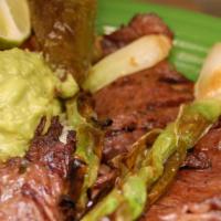 Carne Asada · Seasoned tender flame broiled skirt steak, garnished with pico de gallo, green onions and gu...