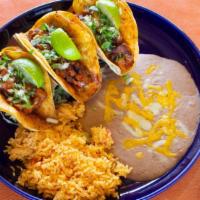 Tacos Al Carbon · Choice of tender steak or chicken flame broiled, sliced and folded into three soft double co...
