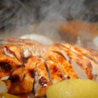Chicken Fajitas · Chicken marinated in our secret sauce, delivered sizzling hot over a bed of sauteed onions a...