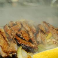 Angus Steak Fajitas · Steak marinated in our secret sauce, delivered sizzling hot over a bed of sauteed onions and...