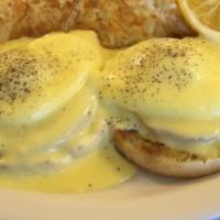 Traditional Eggs Benedict · Favorite. Grilled English muffin, Canadian bacon, poached eggs, and our hollandaise sauce ma...