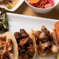 3 Tikka Tacos · choice of corn, flour, or romaine. accompanied with desi slaw, pickled vegetables, raita, ta...