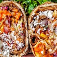 Berliner Doner Wrap · Berliner red sauce, feta, cabbage and carrot slaw, sumac, tomato, onion, cucumber, corn and ...