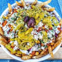 Berliner Fries · Our famous fries topped with our berliner red sauce, tzatziki sauce, cabbage, carrot slaw, c...