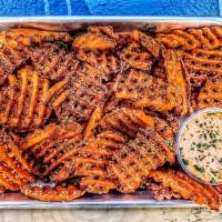 Sweet Potato Fries · Tossed in our secret seasoning. Garlic aioli on the side (small = 1, large = 2)