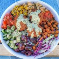 Vegan Remix Bowl · Falafel, dill-tahini quinoa, tomato, cucumber, roasted corn, harissa, kalamata olives, crisp...