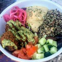 Vegan Medi Bowl · Falafel, tahini and dill quinoa, hummus, pickled red onions, tomato, cucumber, olives, lemon...