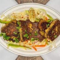 Tawa Swai Fish 2 Pieces · Fish marinated in homemade spices and seared on a skillet.