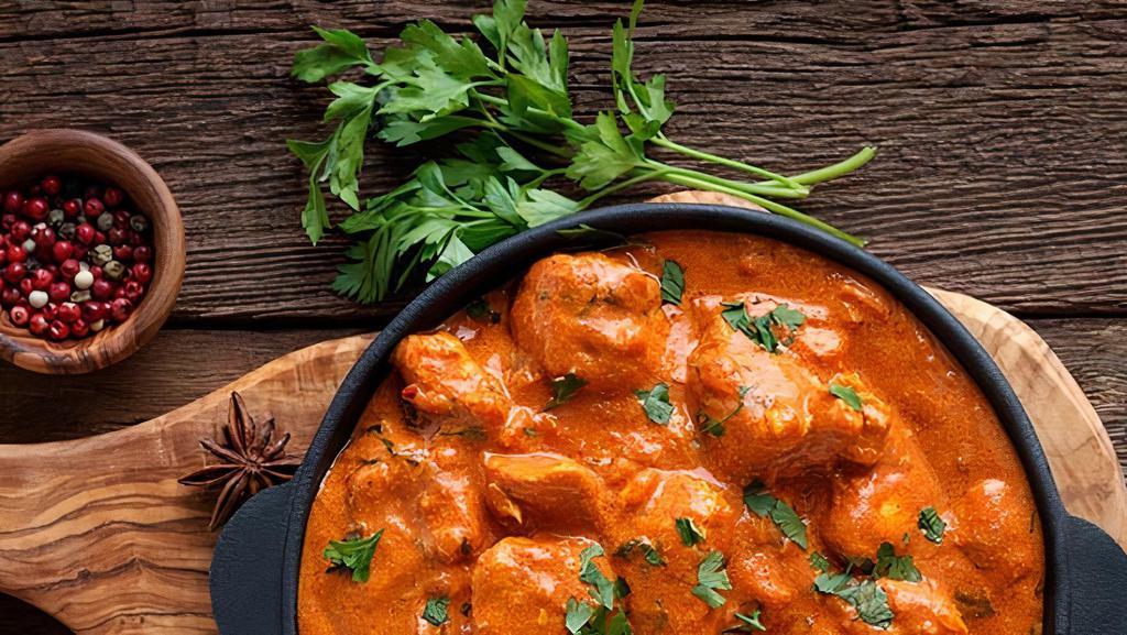 Butter Chicken - Boneless · Chicken breast cooked in onion-tomato sauce and finished with cream and mild Indian spices.