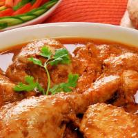 Andhra Chicken Curry Bone Or Boneless · Chicken cooked in onion-tomato sauce and finished with Indian spices.