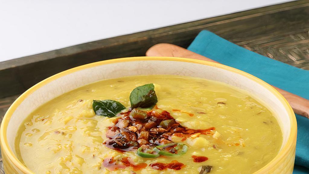 Dal Tadka · Yellow dal cooked with onion, tomato and flavored with generous amount of tempered ghee and spices.