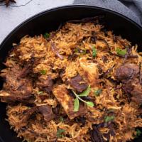 Goat Dum Biryani · Fragrant basmati rice and goat marinated in yogurt and Indian spice layered and cooked in a ...
