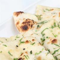 Butter Naan · Flat bread cooked in tandoor and topped with soft butter.