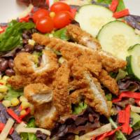 Crispy Chicken Salad · Spring greens, black beans, sweet corn served with honey mustard dressing. Topped with tomat...