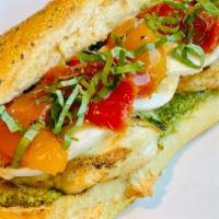 Chicken Caprese Sandwich · Grilled chicken breast, fresh mozzarella, roasted tomatoes and basil pesto on our Italian ro...