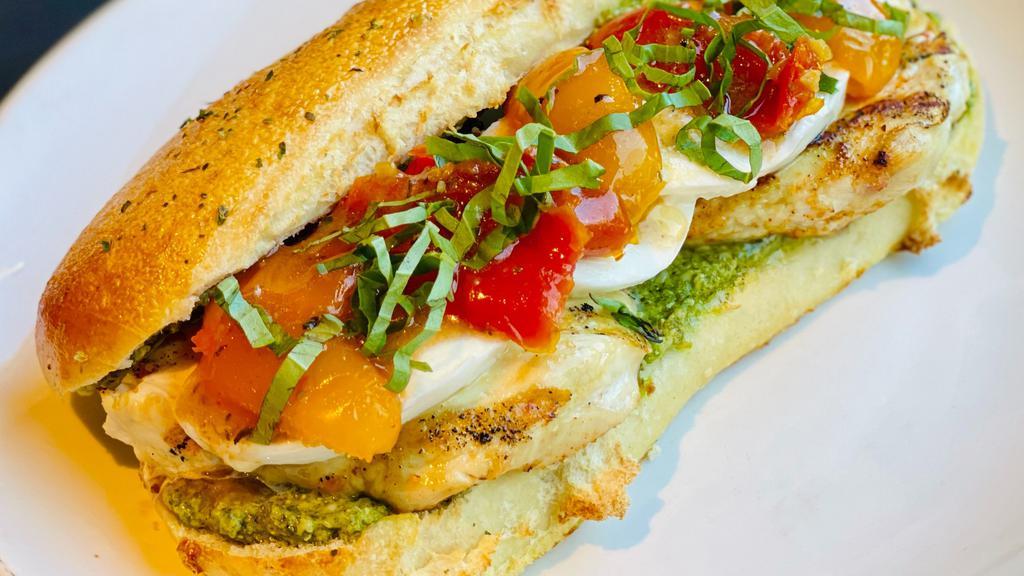 Chicken Caprese Sandwich · Grilled chicken breast, fresh mozzarella, roasted tomatoes and basil pesto on our Italian roll with balsamic vinaigrette.