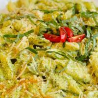 Sweet Basil Pesto Pasta · Creamy basil pesto sauce tossed with mixed pasta and topped with parmesan.