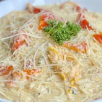 Garlic Parmesan Capellini · Pancetta, sundried tomatoes and fresh herbs in our signature garlic parmesan sauce tossed wi...