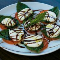 Caprese Platter · Fresh mozzarella, tomato and basil. Drizzled with olive oil and balsamic glaze.
