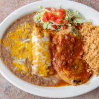 Enchiladas Rancheras · Two enchiladas topped with our ranchera sauce and melted cheese. Served with sour cream and ...