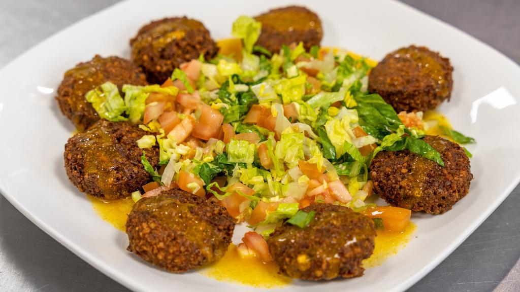 Falafel Platter · 8 pc falafels with salad (tomato,lettuce, pickles and mango amba sauce) with pita bread.
