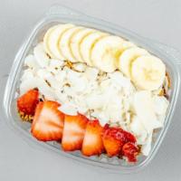 Classic Acai Bowl · Acai blended with almond milk, strawberries, and bananas. Topped with granola, honey, strawb...
