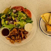Traditional Gyros · Served with a Greek salad, dolma warm pita bread, and baklava. Greek dressing and tzatziki s...