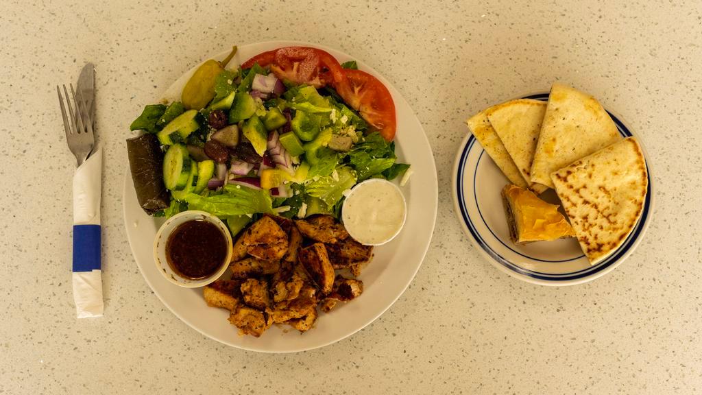 Traditional Gyros · Served with a Greek salad, dolma warm pita bread, and baklava. Greek dressing and tzatziki sauce on the side.