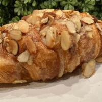 Almond Croissant  · Fluffy almond croissant with chopped almonds and a sugar glaze.