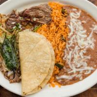 Carne Asada Plato · Served with rice and beans.